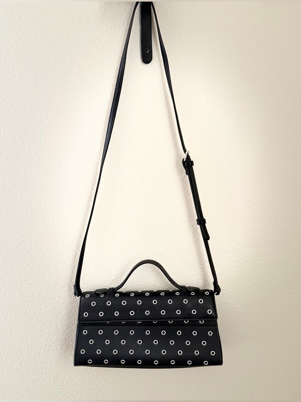 Black Faux Leather East-West Crossbody Bag with Silver Eyelets by Aqua - OS